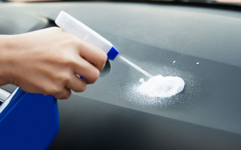 spraying chemicals on car